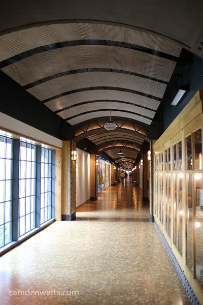Take a right at the top of the stairs to go down the self-guided tour / hallway.